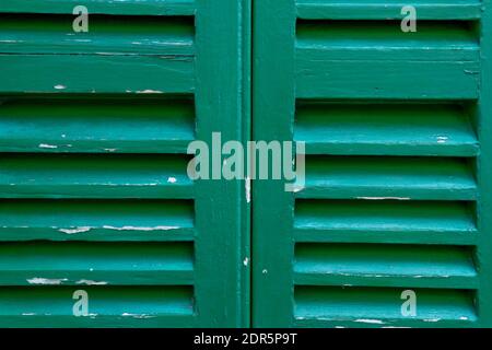 Close-up of a deteriorated green Majorcan blind for background use Stock Photo