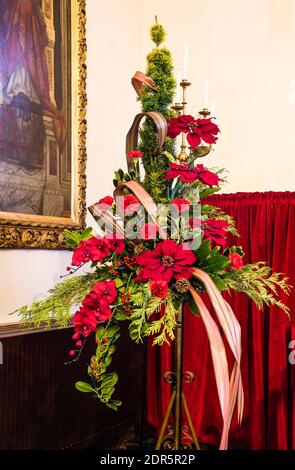 Christmas flower display at All Saints Church in East Budleigh. Stock Photo