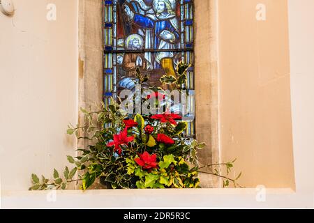 Christmas flower display at All Saints Church in East Budleigh. Stock Photo