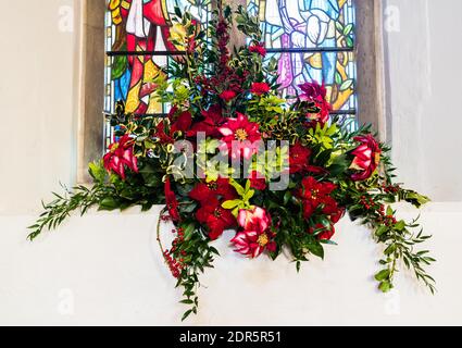 Christmas flower display at All Saints Church in East Budleigh. Stock Photo