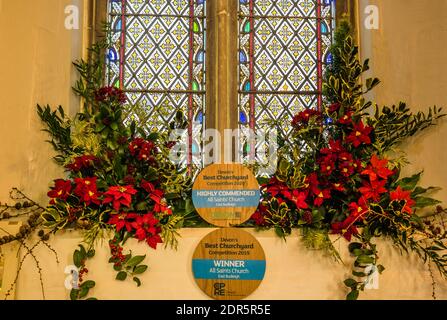 Christmas flower display at All Saints Church in East Budleigh. Stock Photo