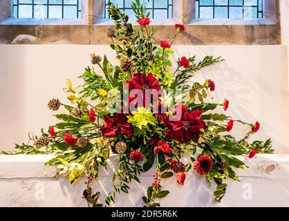 Christmas flower display at All Saints Church in East Budleigh. Stock Photo