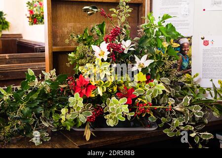 Christmas flower display at All Saints Church in East Budleigh. Stock Photo