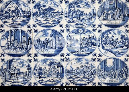 Close up of antique tin glazed porcelain blue Delft wall tiles dating from 1750-80 showing biblical scenes of Jesus Christ from the New Testament Bibl Stock Photo