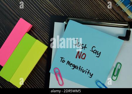 Just Say NO To Negativity write on sticky notes isolated on Wooden Table. Motivation concept Stock Photo