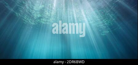 Underwater background, rays of sunlight in the sea below water surface, natural scene, Mediterranean, France Stock Photo