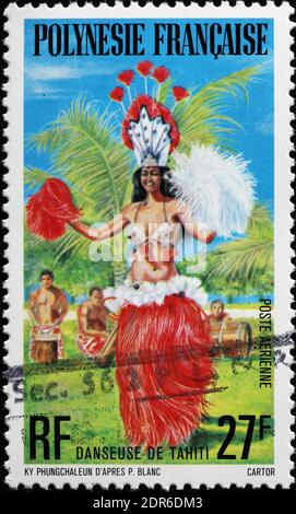 Woman dancing on polynesian postage stamp Stock Photo