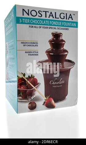 Winneconne, WI -16 December 2020: A package of Nostalgia chocolate fondue fountain on an isolated background. Stock Photo