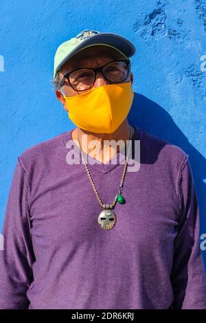 Man wearing a protective face mask to prevent Covid-19, Yucatan Mexico Stock Photo