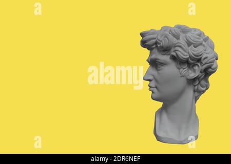 Gypsum statue head. The color of the year 2021 Ultimate Gray Illuminating yellow Stock Photo