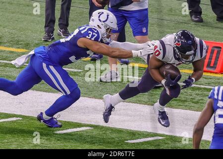 Indianapolis, Indiana, USA. 20th Dec, 2020. Houston Texans running back Scottie Phillips (40) is shoved out of bounds by Indianapolis Colts strong safety Khari Willis (37) short of a first down in the game between the Houston Texans and the Indianapolis Colts at Lucas Oil Stadium, Indianapolis, Indiana. Credit: Scott Stuart/ZUMA Wire/Alamy Live News Stock Photo