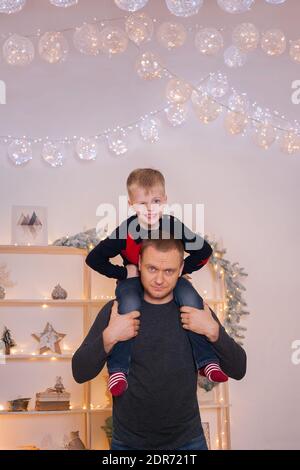 Beautiful family with christmas tree in the living room Stock Photo