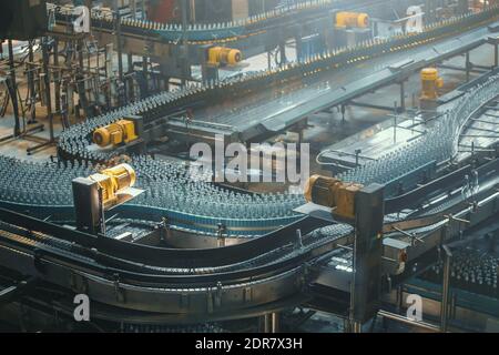 Conveyor belt, beer in bottles, brewery factory industrial production line. Stock Photo