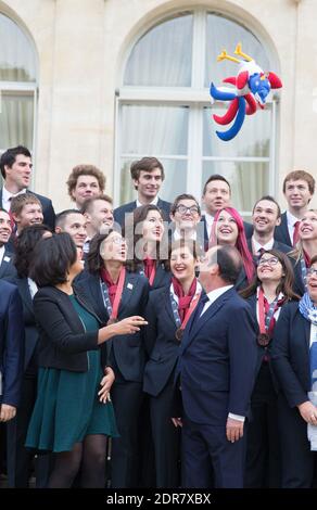 French Minister of Labour, Employment, Vocational Training and Social Dialogue Myriam El Khomri (L) throws a Gallic rooster in the air as President Francois Hollande look on during a family photo with France's 45 contestants of the 2015 WorldSkills, at the Elysee Palace in Paris, France on October 13, 2015. The 43rd Worldskills Competition took place in August 2015 in Sao Paulo, Brazil. The French team ranked 8th winning 9 medals (2 Gold, 4 Silver and 3 Bronze). Photo by Clement Martin/ABACAPRESS.COM Stock Photo