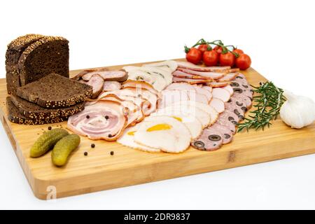 Various meat cold cut platter on a wooden board Stock Photo