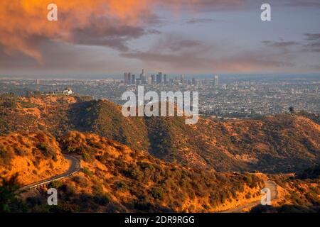 Sunset light and stormy clouds above Griffith Park and downtown Los Angeles. Stock Photo