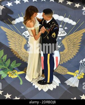 First Lady Melania Trump dances with a Marine at the A Salute to Our Armed Services Ball on January 20, 2017 in Washington, D.C. Trump will attend a series of balls to cap his Inauguration day. Photo by Kevin Dietsch/UPI Stock Photo