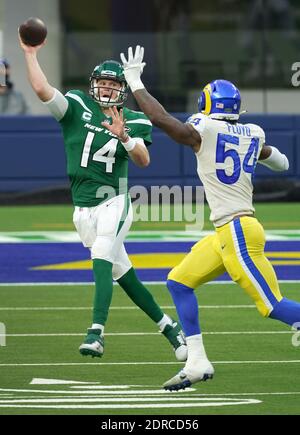 Inglewood, United States. 20th Dec, 2020. New York Jets quarterback Sam Darnold (14) passes the ball past Los Angeles Rams linebacker Leonard Floyd in third quarter action at SoFi Stadium in Inglewood, California on Sunday, December 20, 2020. The Jets upset the Rams 23-20. Photo by Jon SooHoo/UPI Credit: UPI/Alamy Live News Stock Photo