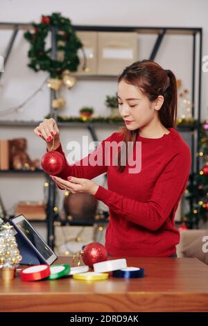 Young woman with red bauble Stock Photo