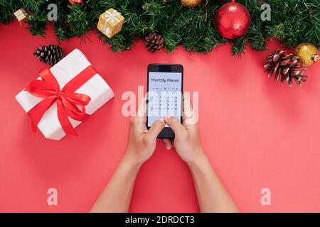 Man checking calendar on smartpone Stock Photo