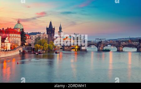 View on Vltava river and Charles bridge in Prague at sunset Stock Photo