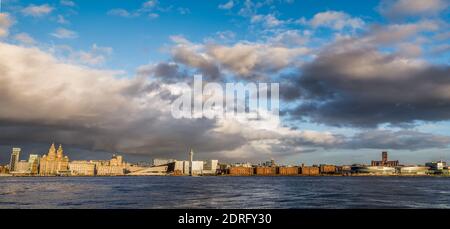 Looking over the River Mersey at the world famous waterfront of Liverpool captured from Woodside on the Wirral in December 2020. Stock Photo
