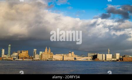 Looking over the River Mersey at the world famous waterfront of Liverpool captured from Woodside on the Wirral in December 2020. Stock Photo