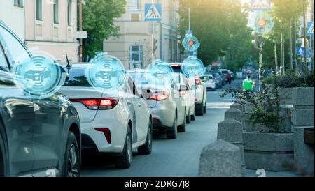 Vehicle to vehicle communication. Data exchange between cars. Stock Photo