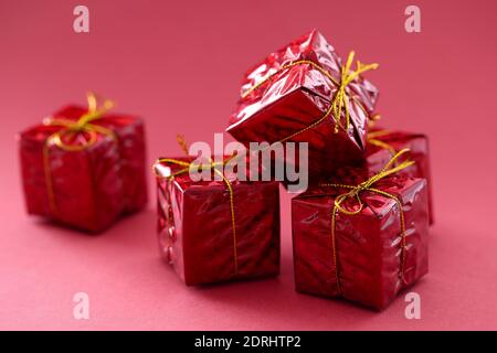 Small gift boxes in red on red background Stock Photo
