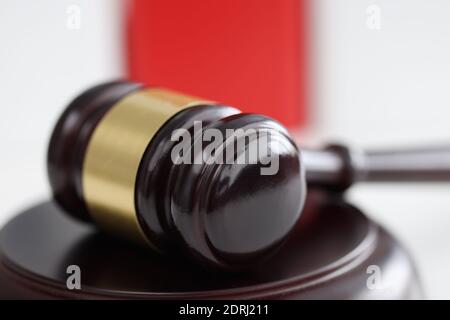 Wooden gavel for judge and auctions lies on stand