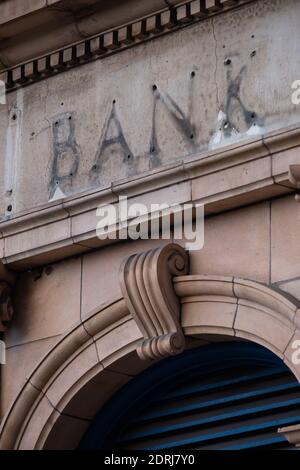 The remains of a sign over a former branch of Barclays Bank, now closed, in Kew Gardens, south west London. Stock Photo