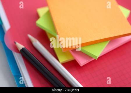 Colored white and black pencil stickers on folder Stock Photo