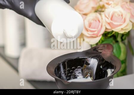 Hair dye measuring and mixing kit. Mixing bowl and hair dye brush on  electronic scale. Hair coloring tools set. Professional instrument for hair  color Stock Photo - Alamy