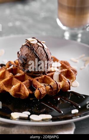 Viennese waffles with ice cream, chocolate. Close-up. On the plate. Stock Photo