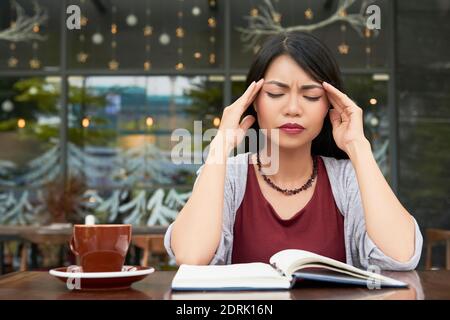 Woman suffering from headache Stock Photo