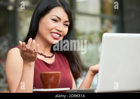 Video calling young woman Stock Photo