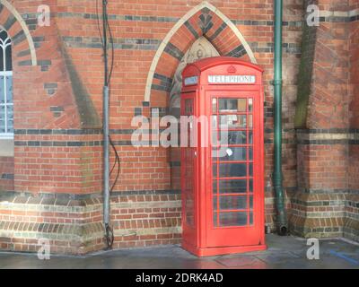 Red telephone booth outside Wokingham Town Hall, Berkshire, UK Stock Photo