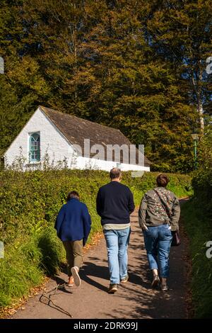 UK, Wales, Cardiff, St Fagans, National Museum of History,  visitors walking to Pen-Rhiw Chapel Stock Photo