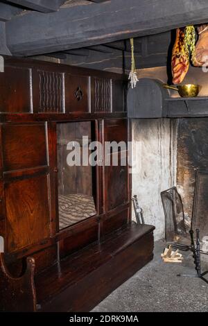 UK, Wales, Cardiff, St Fagans, National Museum of History, Kennixton Farmhouse originally from Llangennith, Gower, living room interior with box-bed b Stock Photo