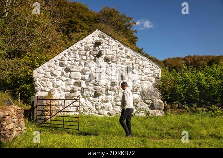 UK, Wales, Cardiff, St Fagans, National Museum of History, 1752 Llainfadyn Cottage from Snowdonia, built with large stone boulders Stock Photo