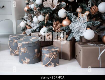 many different boxes with gifts under the tree Stock Photo