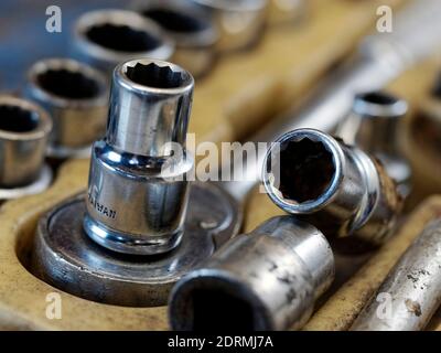 Close up view of socket spanners (socket wrenches) and a ratchet wrench handle in a tool tray Stock Photo