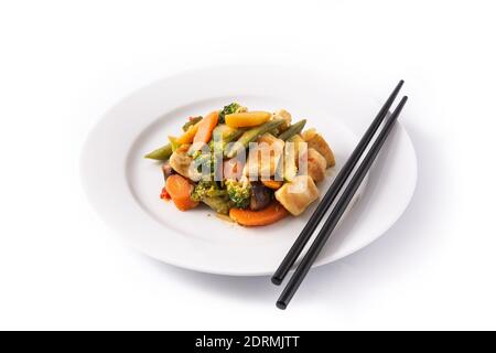 Stir fry chicken with vegetables on plate isolated on white background Stock Photo