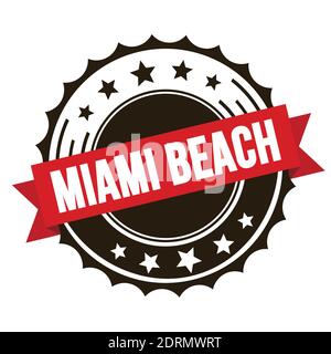 MIAMI BEACH text on red brown ribbon badge stamp. Stock Photo