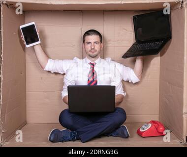 happy multitasking businessman ready for new challenges at work, multimedia tools in hands Stock Photo
