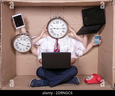happy multitasking businessman ready for new challenges at work, clock instead of head Stock Photo