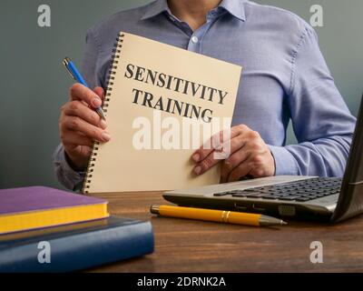 Sensitivity training concept. The manager holds the documents. Stock Photo