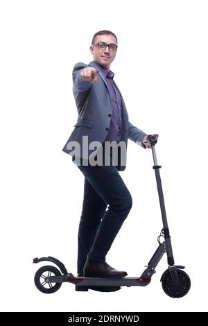 Pleasant smiling man riding a kick scooter Stock Photo