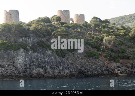 Ithaca in Greece: old windmill towers near the pretty vlllage of Kioni Stock Photo