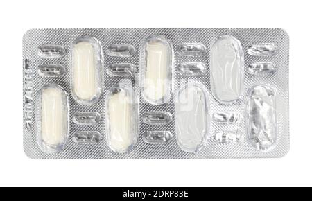 Empty blister pack of tablets isolated on a white background. Pack of pills without tablets. Stock Photo